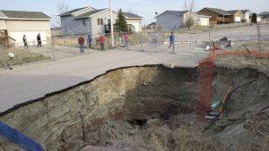 Families in South Dakota Neighborhood on Edge as Giant Sinkholes Threaten Safety